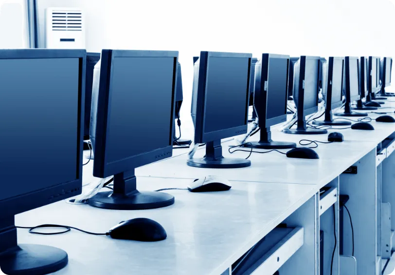 Rows of computer workstations in a training room